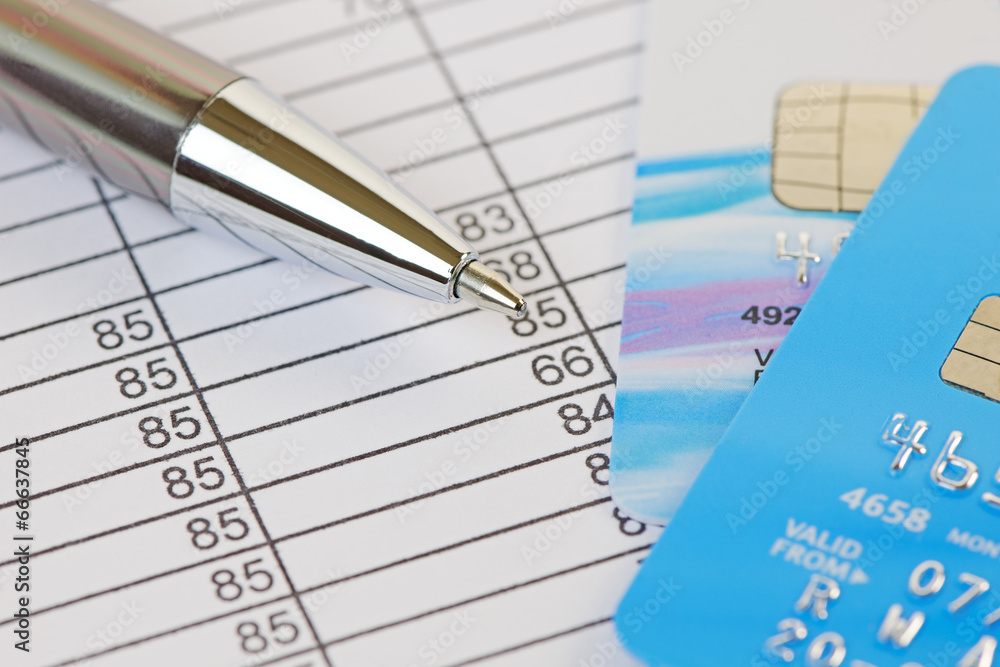 Pen and Credit Cards on a Financial Spreadsheet Pen and Credit Cards on a Financial Spreadsheet