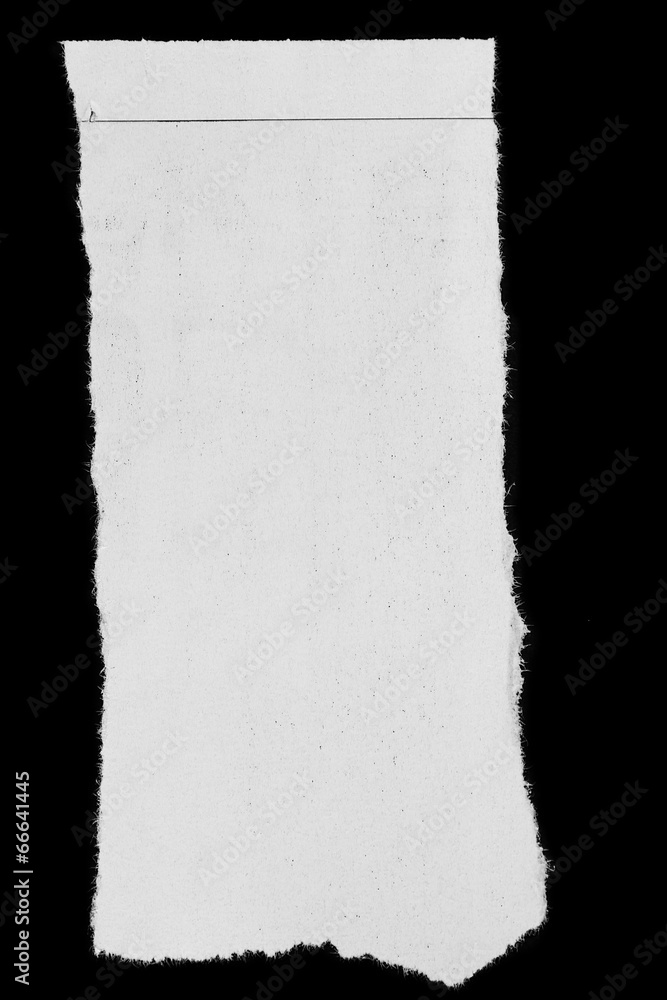 Torn white paper on black