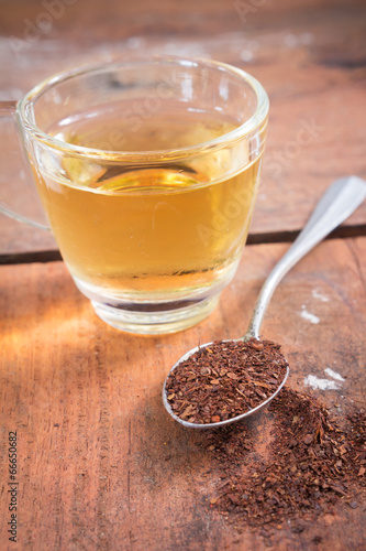 Tea powder and drink water in glass.