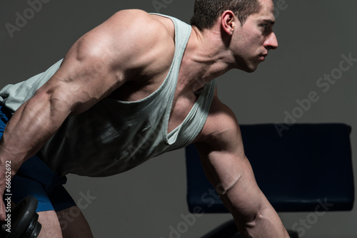 Muscular Men Doing Heavy Weight Exercise For Triceps