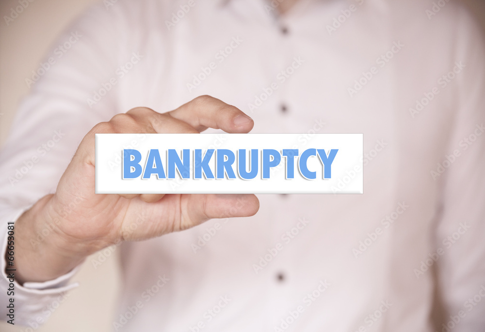 Man holding a word: Bankruptcy Man holding a word: Bankruptcy