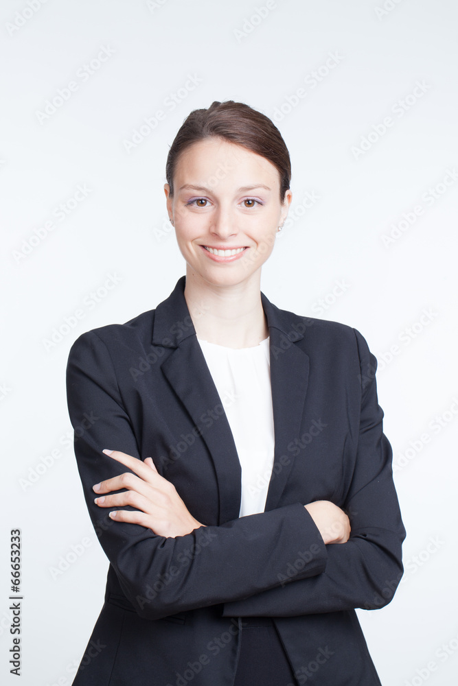 Young businesswoman in blu suit posing at white background Young businesswoman in blu suit posing at white background