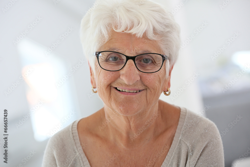 Portrait of smiling elderly woman with eyeglasses Portrait of smiling elderly woman with eyeglasses