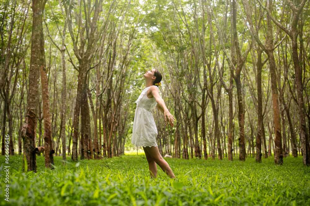 Beautiful romantic woman happy in the forest Beautiful romantic woman happy in the forest