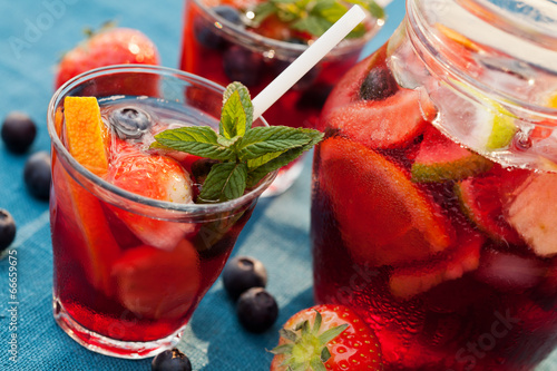 Refreshing sangria (punch) with fruits photo