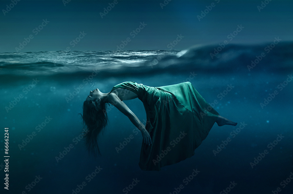 Woman floating underwater - obrazy, fototapety, plakaty 