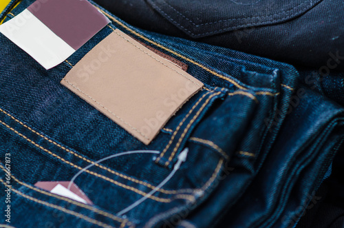Leather jeans label sewed on jeans.