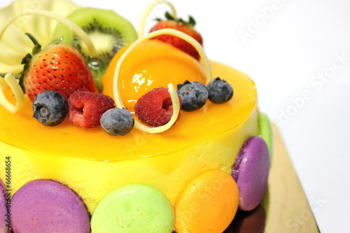 peach mousse cake and topped with fresh fruit.