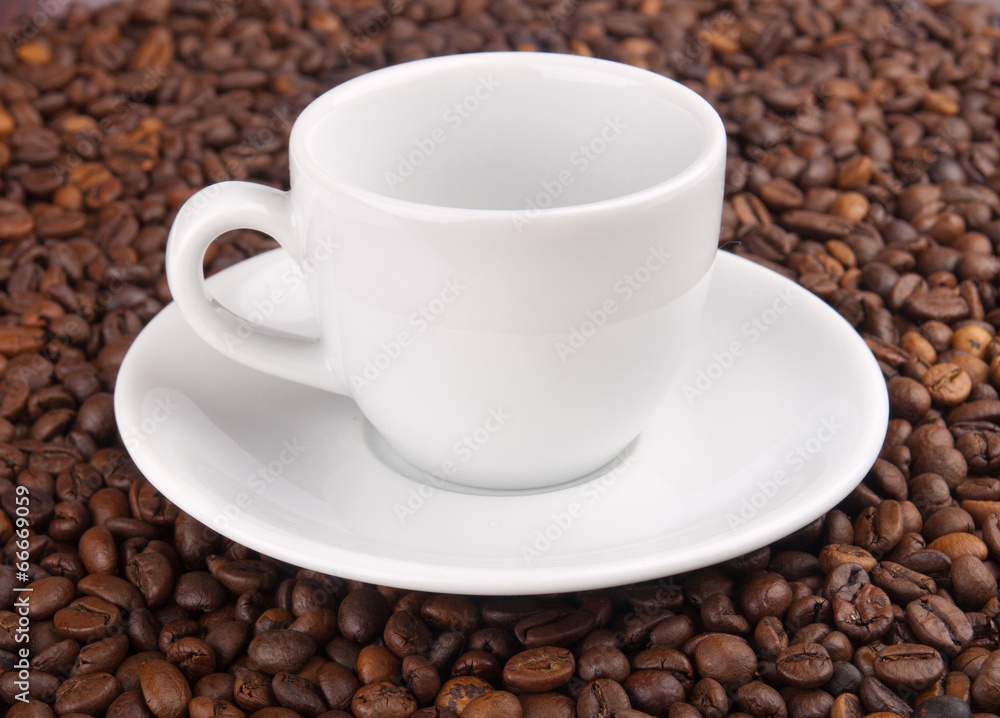 A white cup on beans background A white cup on beans background