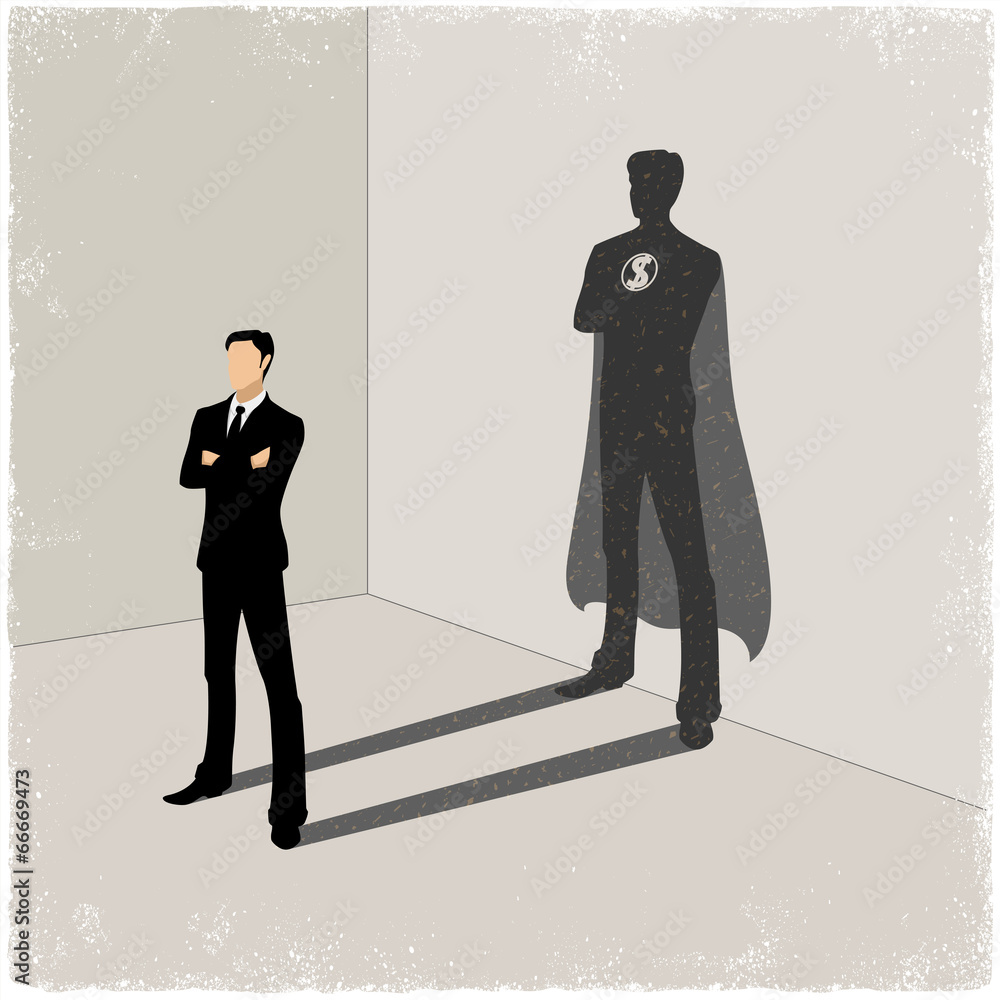 Businessman casting superhero shadow Businessman casting superhero shadow