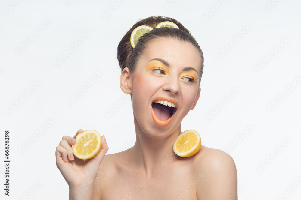 Young woman with oranges and makeup Young woman with oranges and makeup
