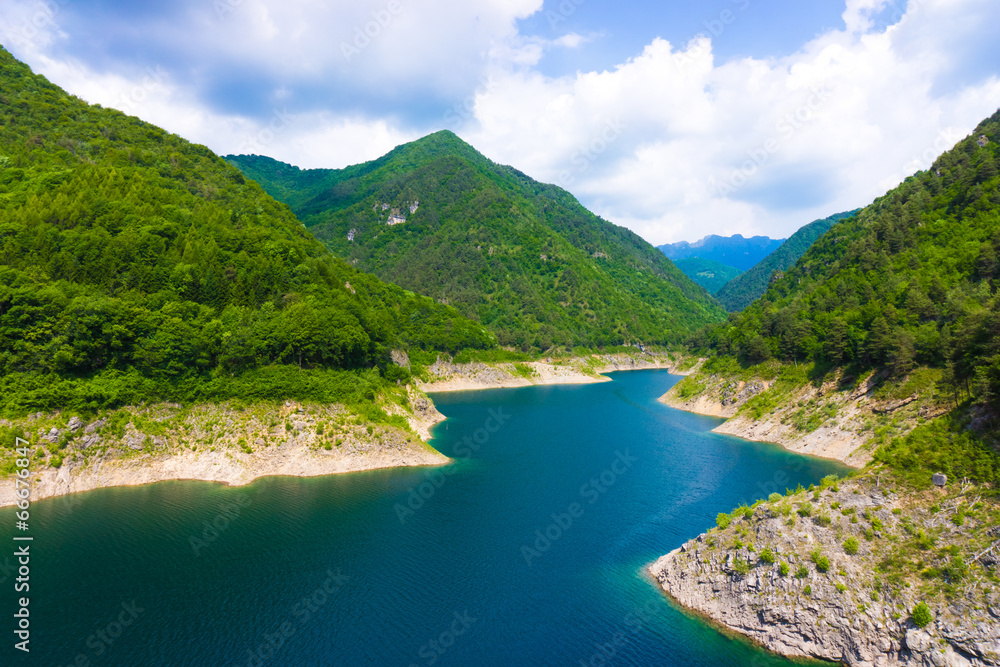 Mountain lake. Beautiful landscape with lake, forest and mounta Mountain lake. Beautiful landscape with lake, forest and mounta