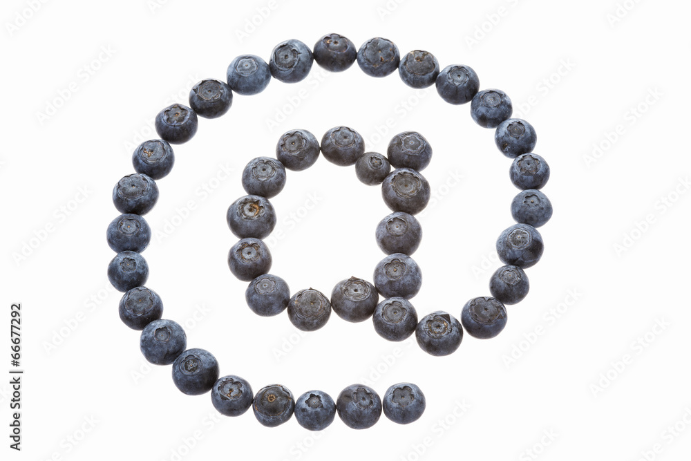 Obraz premium At sign made from blueberries