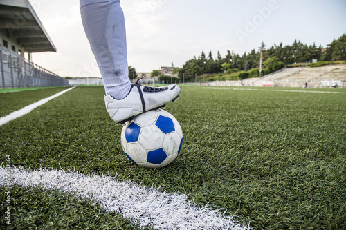 soccer field with ball and foot