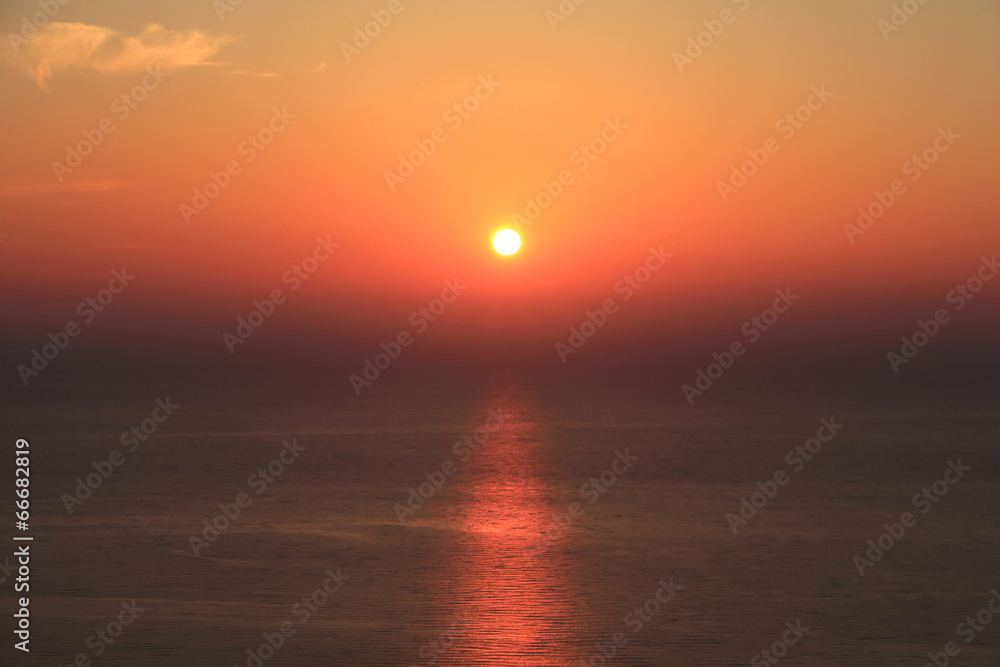 Red sunset reflected in the sea