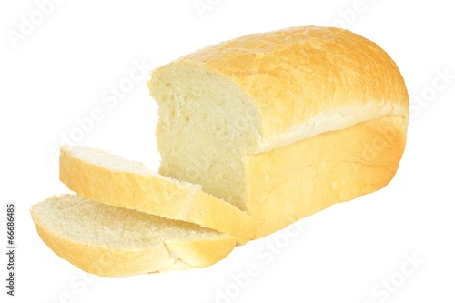 Loaf of bread with think cut slices isolated on white