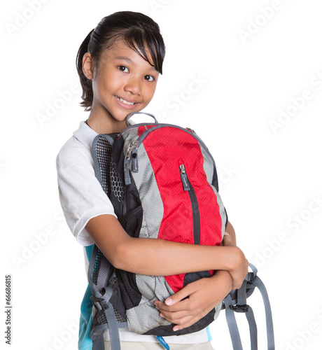 Young Asian school girl with backpack in school uniform