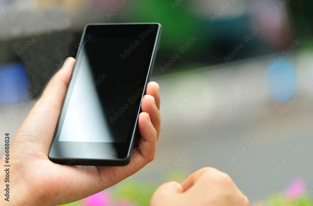 woman hand hold smart phone in modern city woman hand hold smart phone in modern city