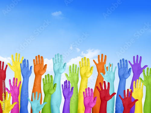Colorful Hands Raised With Blue Sky