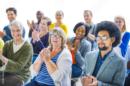 Group of Cheerful People Clapping with Gladness