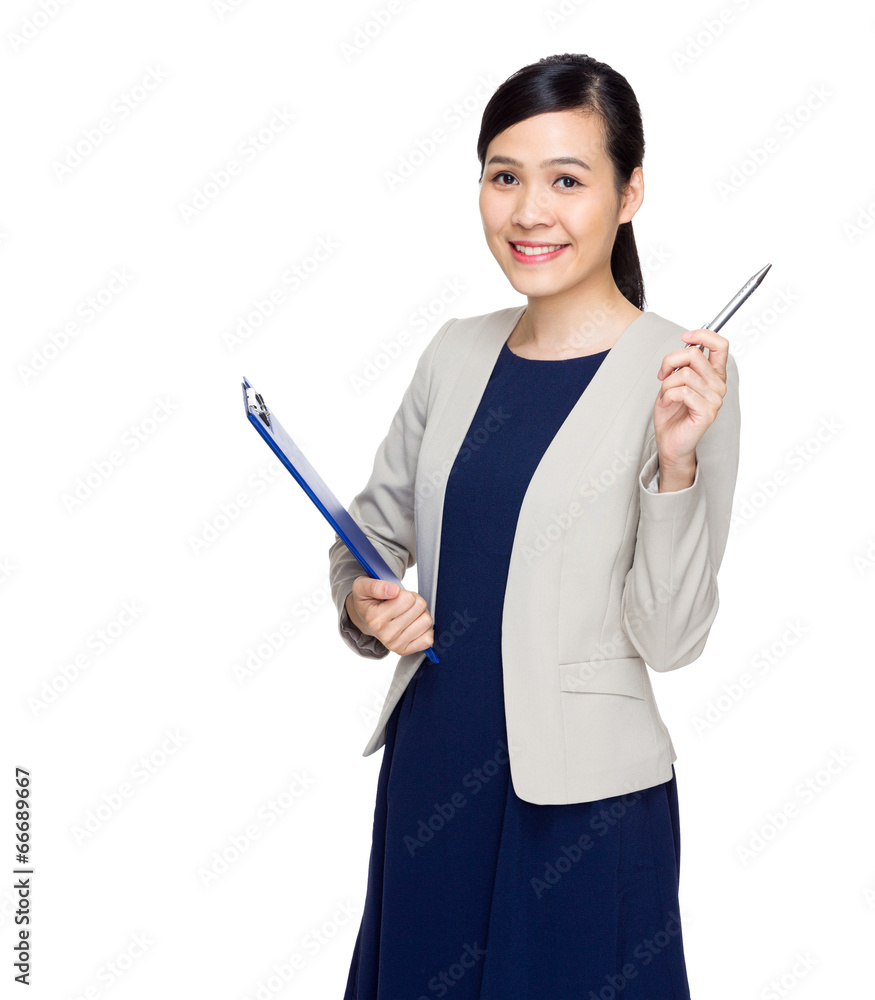 Businesswoman with clipboard and pen point up Businesswoman with clipboard and pen point up