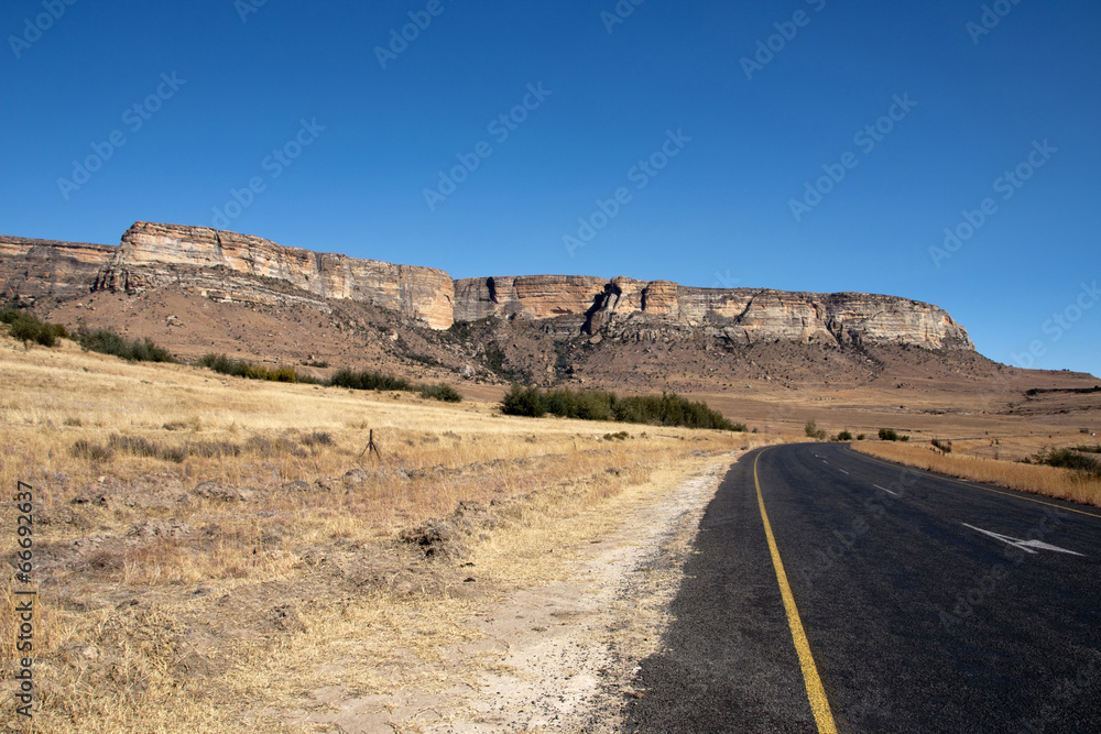 Curved Rural Road with Panoramic View of Mountains