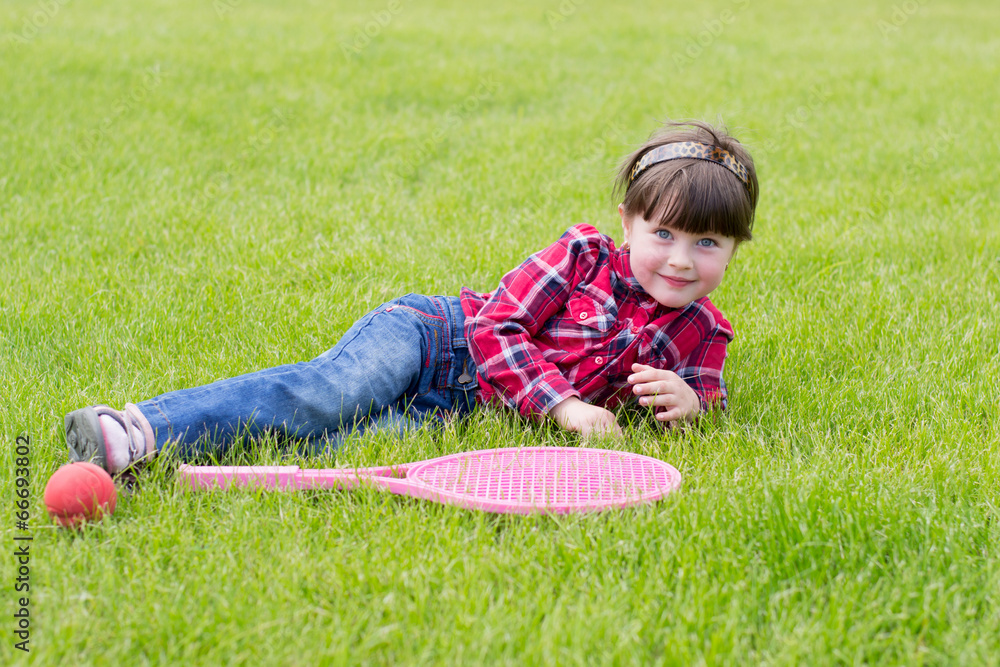 Fototapeta premium little girl on the grass