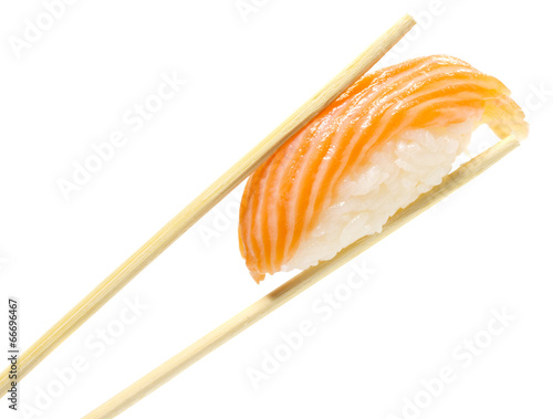 Salmon sushi nigiri in chopsticks isolated on white background