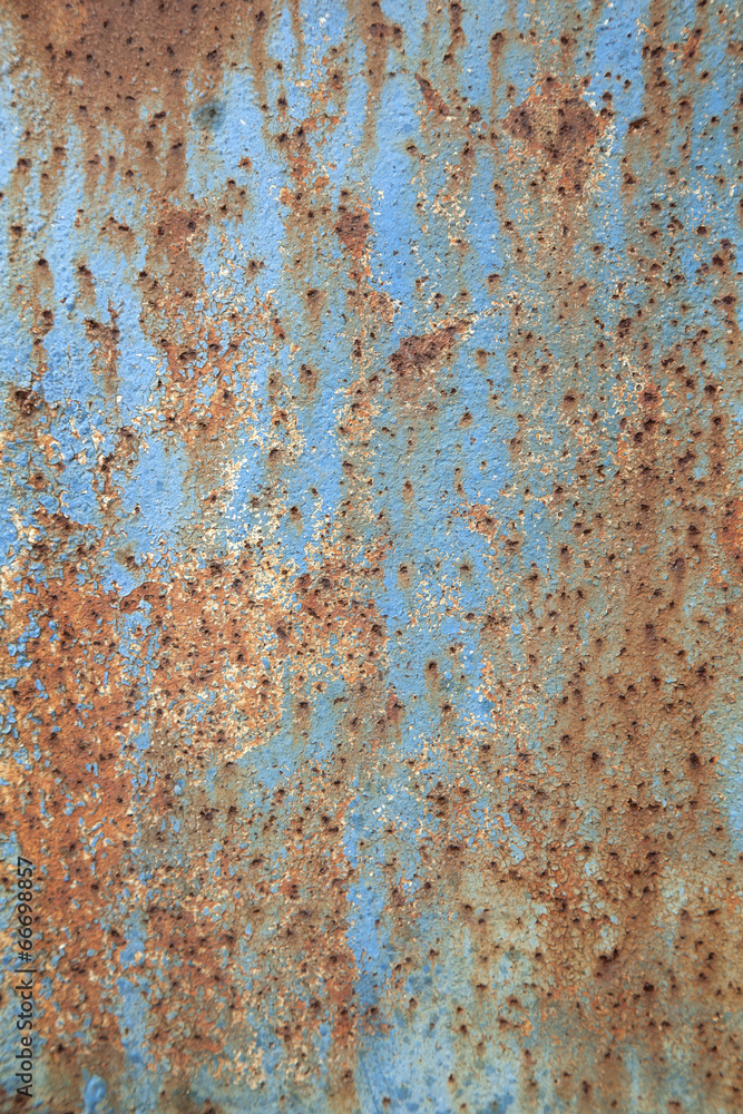 rusty metal with peeling blue paint