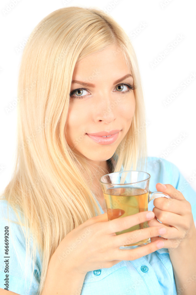 Young beautiful woman with cup of tea isolated on white Young beautiful woman with cup of tea isolated on white