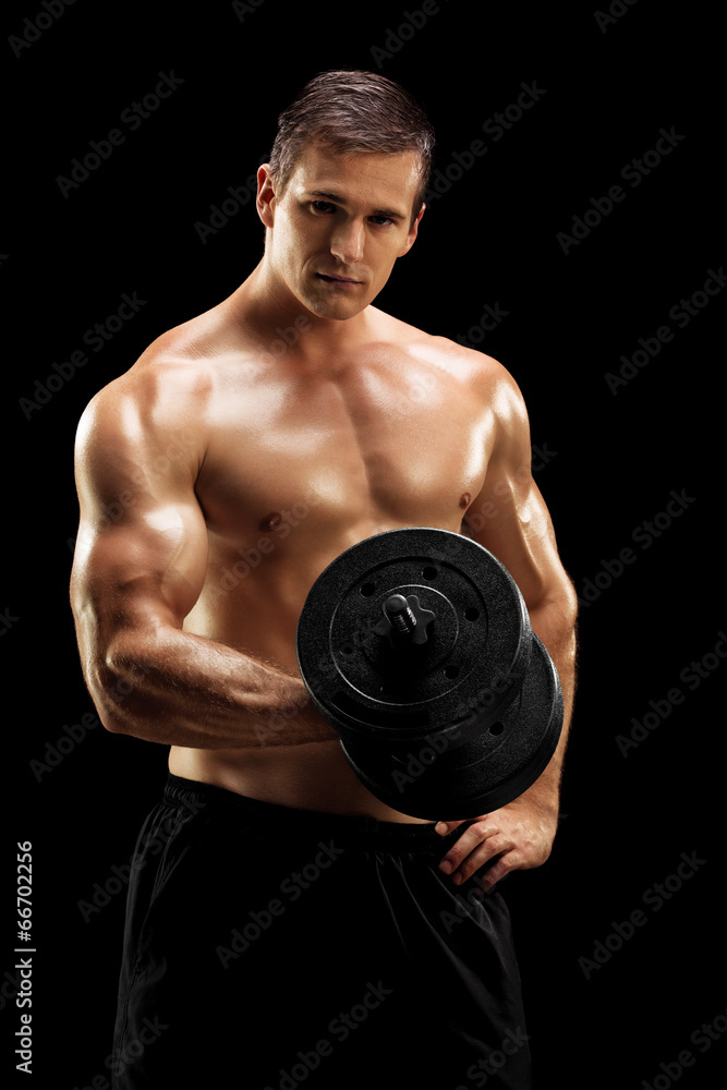 Handsome bodybuilder exercising with barbell