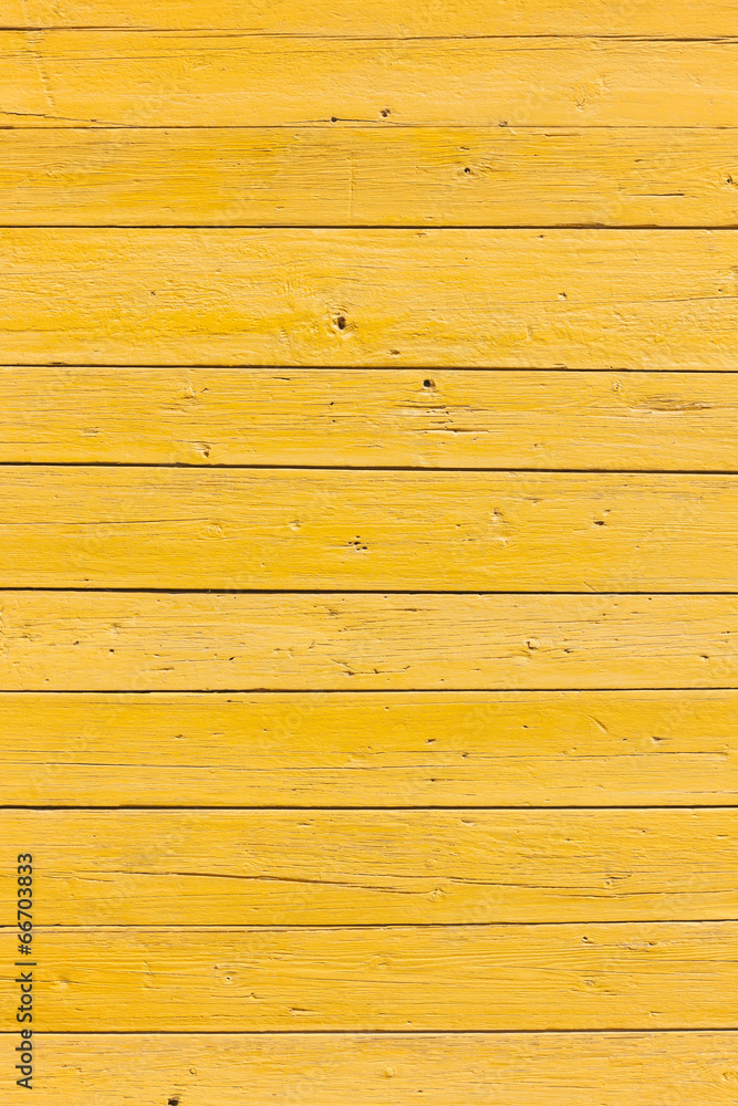 Obraz premium old planks with bright yellow paint