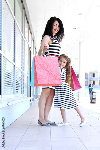 Happy mom and daughter with...