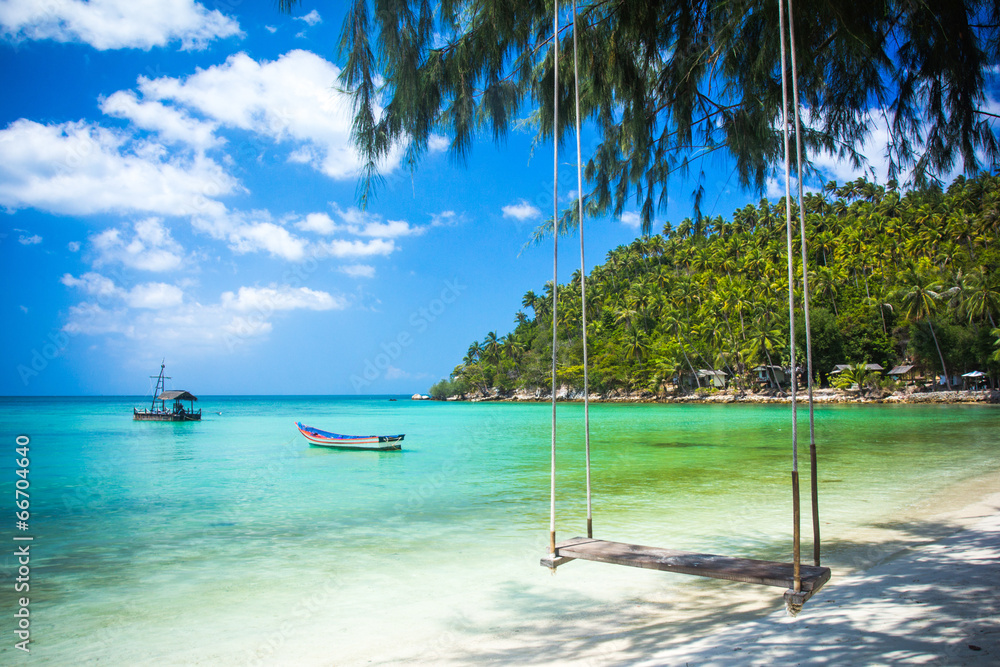 Swing hang from coconut tree over beach, Phangan island