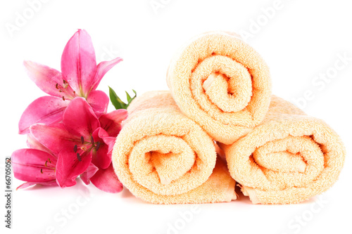 Fototapeta Naklejka Na Ścianę i Meble -  Color towels and lily flowers, isolated on white