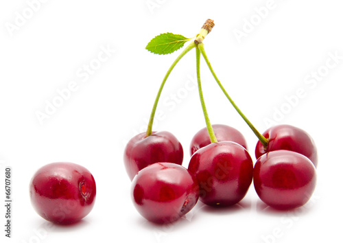 Juicy cherry with leaf isolated