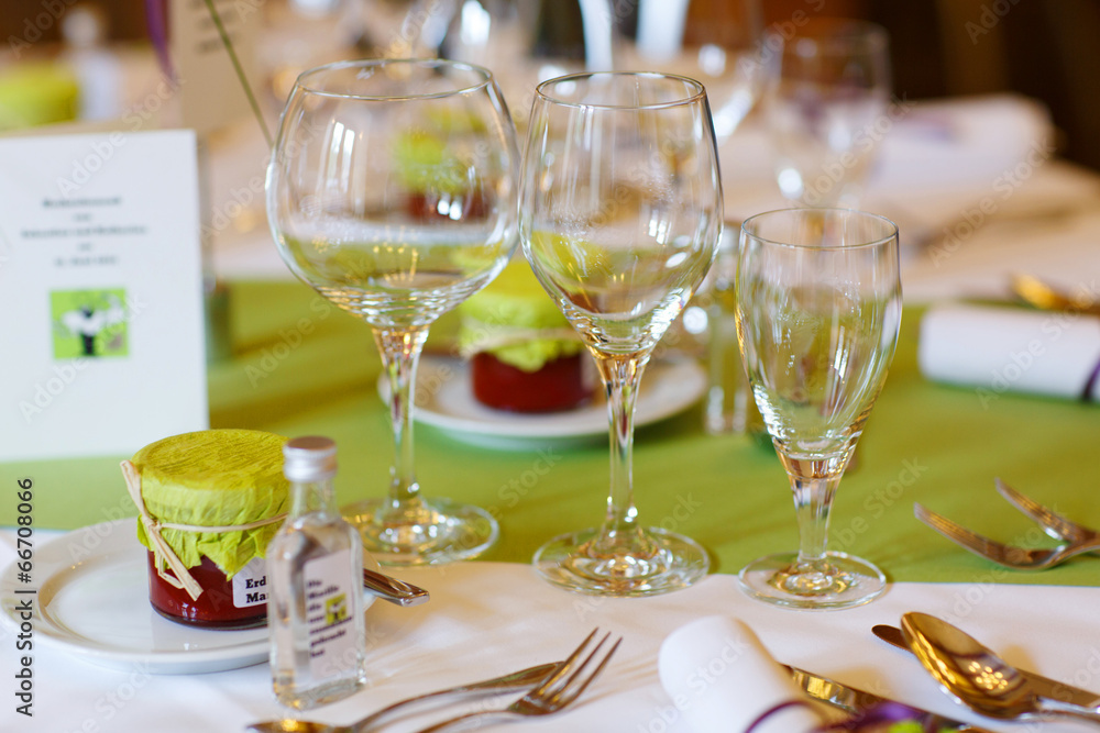 Elegant table set in purple and green for wedding or event party Elegant table set in purple and green for wedding or event party