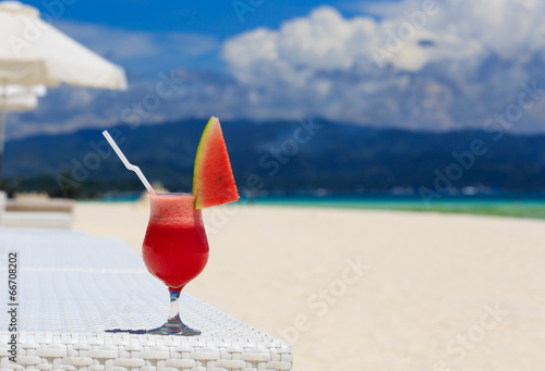 watermelon cocktail on blue tropical beach