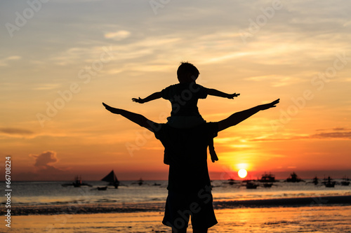 happy family on sunset beach