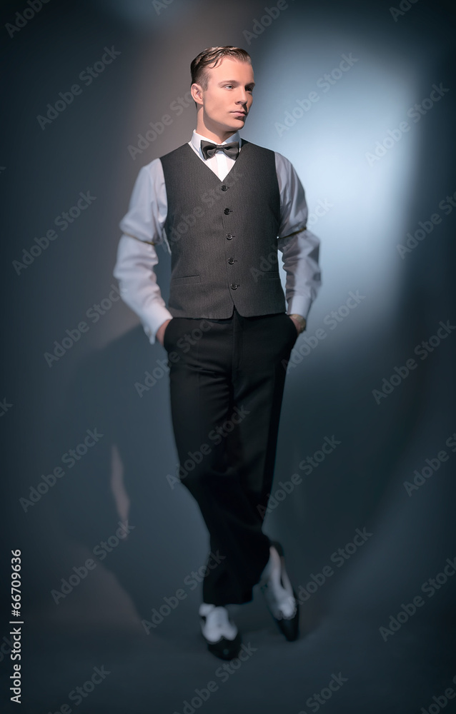 Retro classic business fashion man wearing grey gilet and bow ti Retro classic business fashion man wearing grey gilet and bow ti