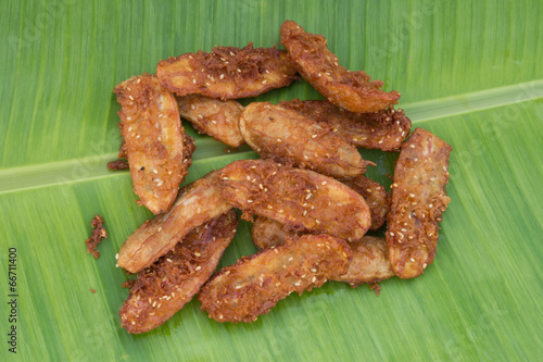 Fried banana on green banana leaf