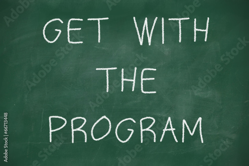 Get with the program handwritten on blackboard