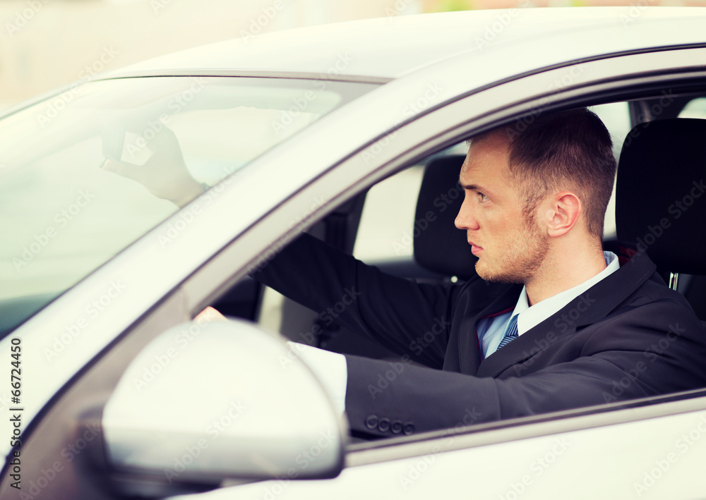 businessman driving a car