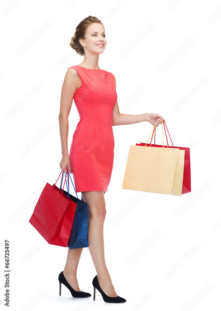 smiling elegant woman in dress with shopping bags smiling elegant woman in dress with shopping bags