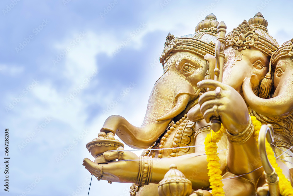 The statute Ganesha outdoor against blue sky and white clouds