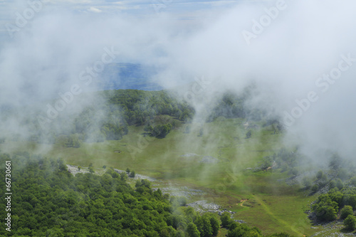 Beautiful mountain scenery in the Alps in summer and clouds © Calin Tatu