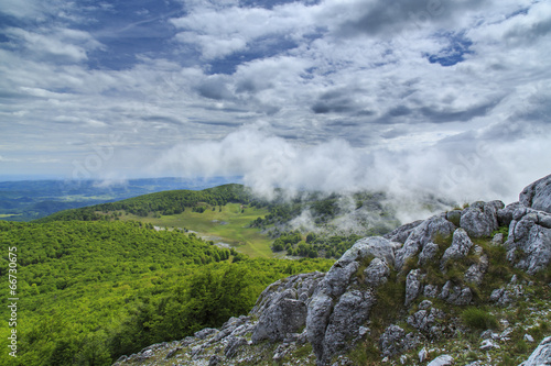 Beautiful mountain scenery in the Alps in summer and clouds