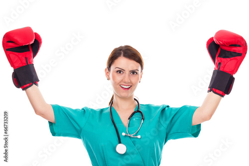 Obraz na płótnie Happy young female doctor or nurse wearing boxing gloves w salonie