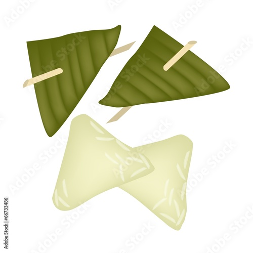 Stuffed Dough Triangle Dessert Wrapped in Banana Leaf photo