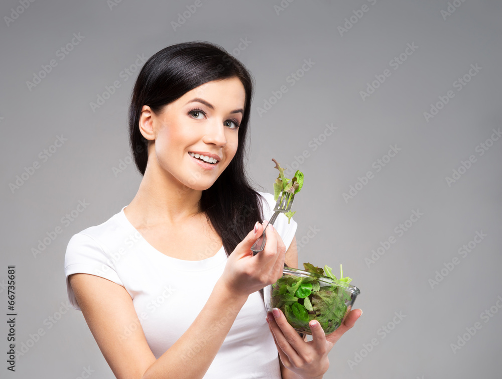 Young, beautiful and healthy teenage girl with a bowl of salad Young, beautiful and healthy teenage girl with a bowl of salad